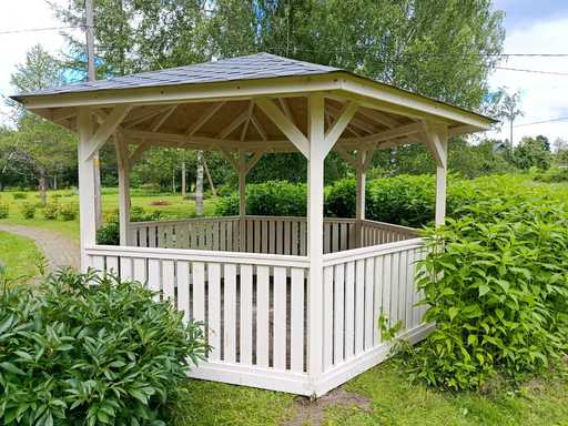 Six-sided wooden gazebo — cozy garden gazebo with floor and covered roof