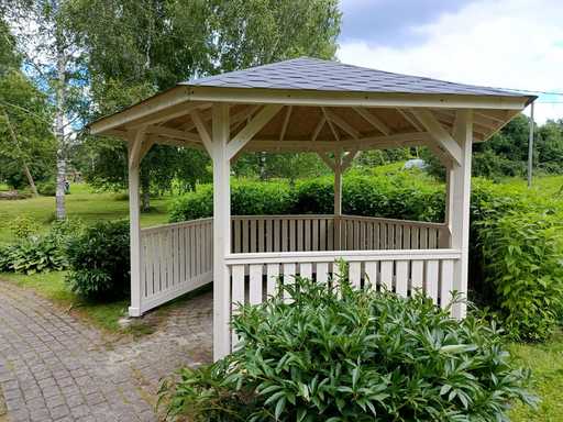 Six-sided wooden gazebo — cozy garden gazebo with floor and covered roof